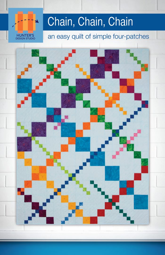 The Chain Chain Chain quilt is made up of squares arranged in diagonal lines of color. The different lines are made in different sized squares.