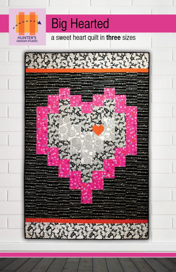 Big Hearted features strip based construction to create a pixellated heart. In the cover quilt, the heart is made with black, pink and black and white fabrics.