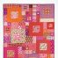 Image is of the cover of the Fourteen Squared Fussy Cutting addendum. Quilt pictured is in pinks, oranges and purples featuring fussy cut fabric.